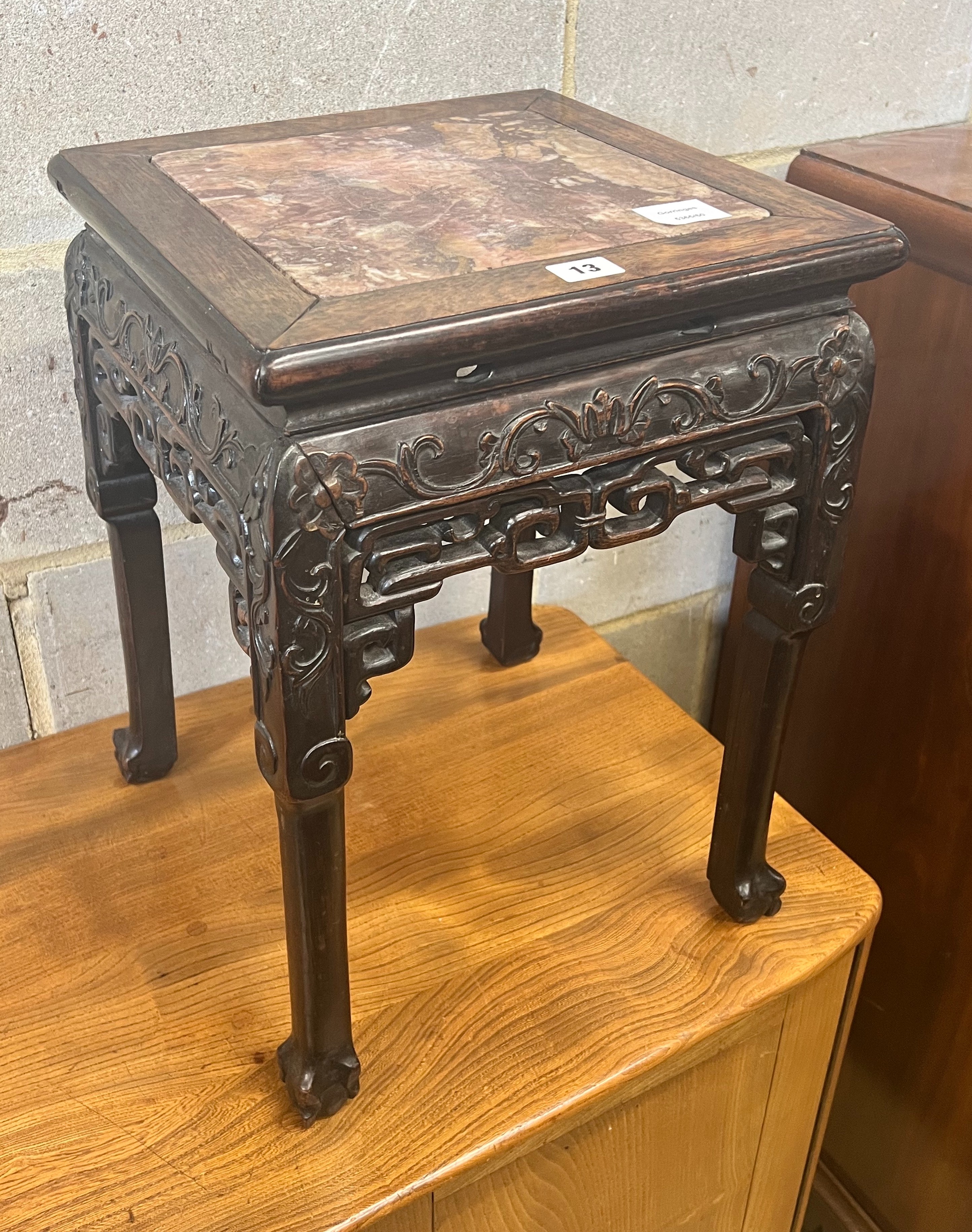 A Chinese marble topped carved hardwood jardiniere stand, width 35cm depth 35cm height 47cm